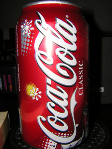 Surfing the web and drinking some Coke.